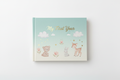Baby memory book with teal, blue and cream hardcover, gold foil title, delicate illustrated design