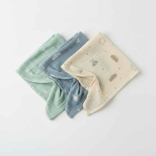 Set of three soft baby muslin squares in teal, mint and cream