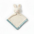 Soft baby comforter with plush bunny head, cream blanket and blue satin edge