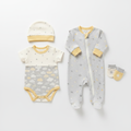 Newborn gift set flat lay with zip-up babygro, hat, vest and mittens in cream, yellow and grey